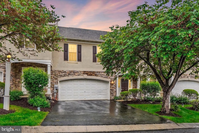 4 Hardy Ct, Lancaster, PA 17602 - view of front of property featuring stone siding, stucco siding, driveway, and an attached garage