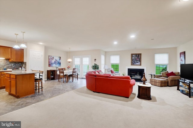 4 Hardy Ct, Lancaster, PA 17602 - living area featuring healthy amount of natural light, light colored carpet, recessed lighting, and a glass covered fireplace