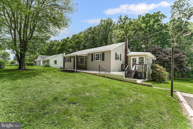 320 Lees Brg, Nottingham, PA 19362 - view of front of house with a deck, a front lawn, and a chimney