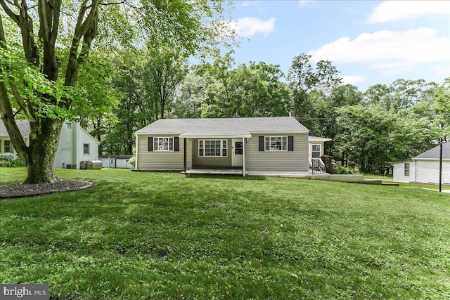 320 Lees Brg, Nottingham, PA 19362 - view of front of house with a front lawn, a chimney, and view of wooded area
