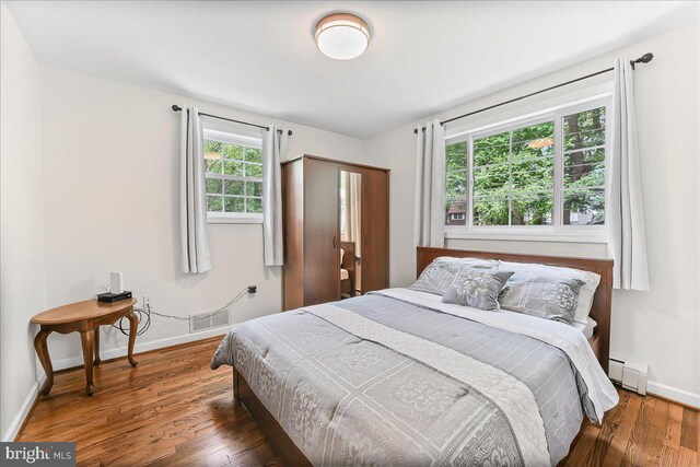 320 Lees Brg, Nottingham, PA 19362 - bedroom featuring a baseboard radiator, baseboards, and wood finished floors
