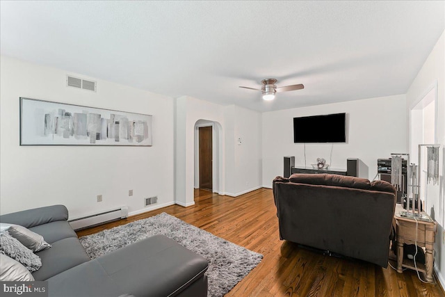 320 Lees Brg, Nottingham, PA 19362 - living room with a baseboard radiator, arched walkways, wood finished floors, and a ceiling fan