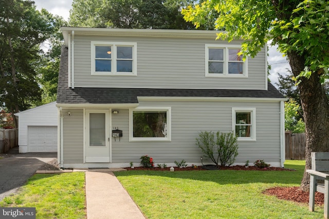 143 Baker St, Manassas Park, VA 20111 - traditional-style home featuring a garage, driveway, and roof with shingles