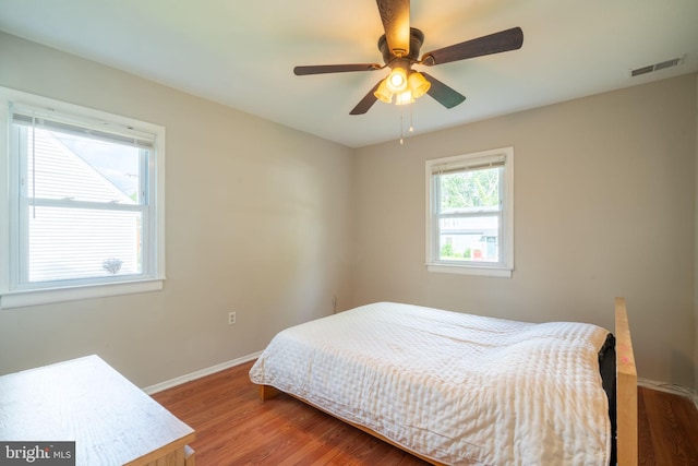 143 Baker St, Manassas Park, VA 20111 - bedroom featuring wood finished floors, baseboards, and a ceiling fan