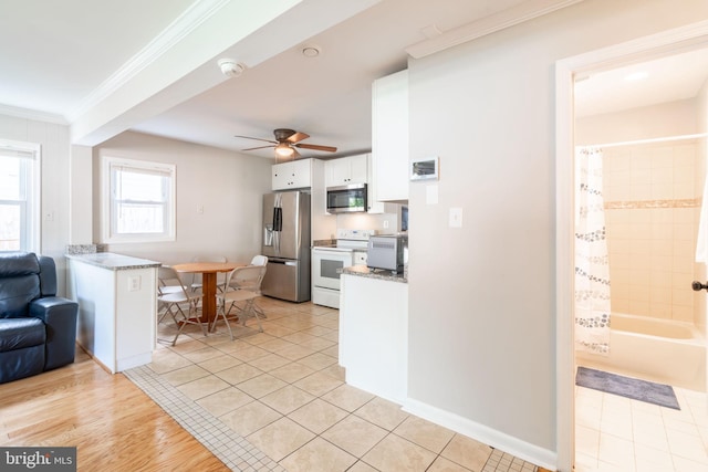 143 Baker St, Manassas Park, VA 20111 - kitchen with appliances with stainless steel finishes, white cabinetry, ornamental molding, ceiling fan, and light stone counters