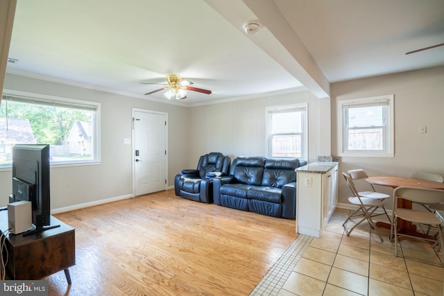 143 Baker St, Manassas Park, VA 20111 - living area with ceiling fan, plenty of natural light, crown molding, baseboards, and light tile patterned floors