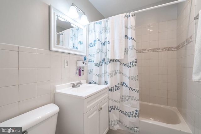 143 Baker St, Manassas Park, VA 20111 - bathroom featuring vanity, toilet, shower / bath combo with shower curtain, and tile walls