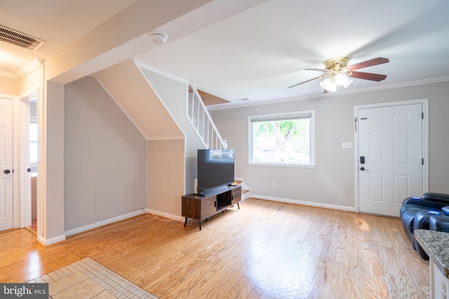 143 Baker St, Manassas Park, VA 20111 - living room featuring crown molding, light wood-type flooring, a ceiling fan, stairway, and baseboards