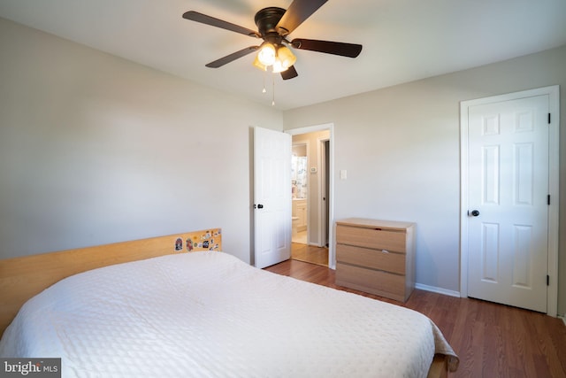 143 Baker St, Manassas Park, VA 20111 - bedroom with wood finished floors, baseboards, and a ceiling fan