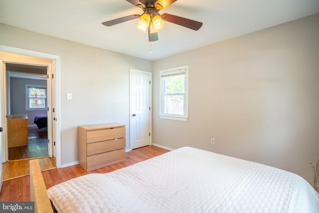 143 Baker St, Manassas Park, VA 20111 - bedroom with multiple windows, baseboards, light wood-type flooring, and ceiling fan
