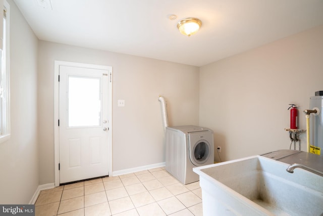 143 Baker St, Manassas Park, VA 20111 - washroom with washer / dryer, light tile patterned floors, and baseboards