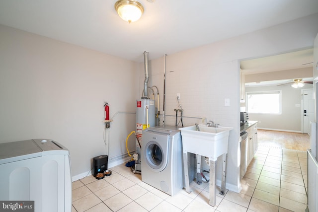 143 Baker St, Manassas Park, VA 20111 - laundry room with washer and dryer, light tile patterned floors, gas water heater, and a ceiling fan
