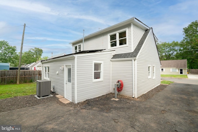 143 Baker St, Manassas Park, VA 20111 - rear view of property with cooling unit and a shingled roof