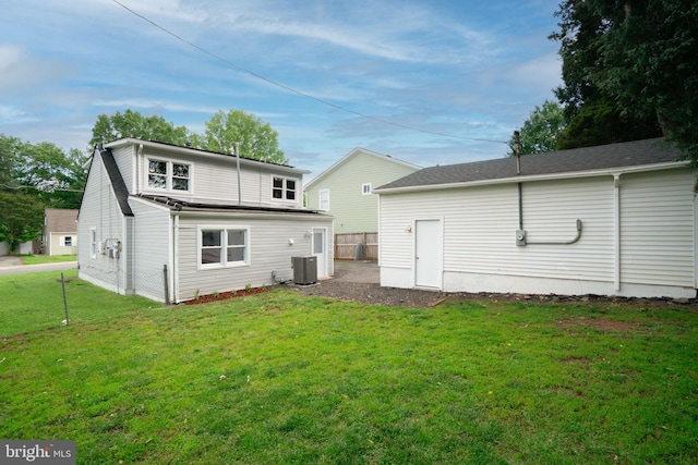 143 Baker St, Manassas Park, VA 20111 - back of property with a lawn and cooling unit