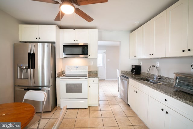143 Baker St, Manassas Park, VA 20111 - kitchen featuring stainless steel appliances, a ceiling fan, light tile patterned floors, and white cabinets