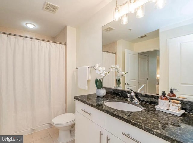 157 Fleet Unit 307, Oxon Hill, MD 20745 - bathroom with tile patterned flooring, vanity, toilet, and a shower with curtain