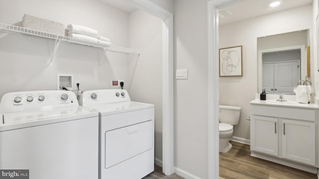 210 Bentz Ave, Villas, NJ 08251 - laundry area with washer and clothes dryer, wood finished floors, and baseboards