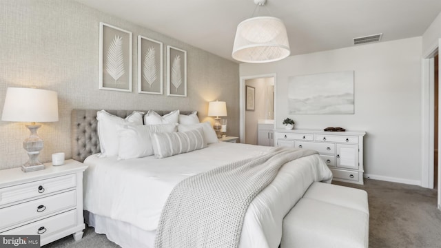 210 Bentz Ave, Villas, NJ 08251 - bedroom with dark carpet, connected bathroom, and baseboards