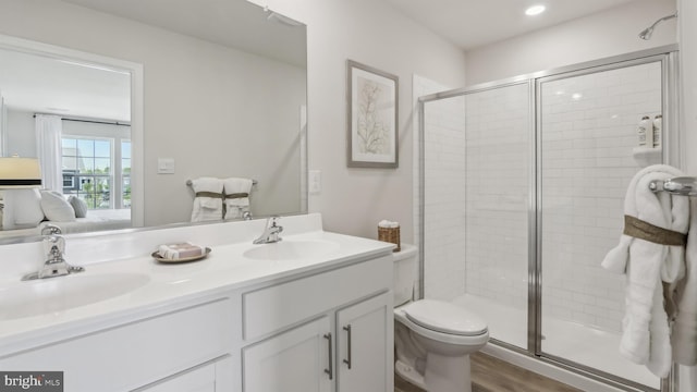 210 Bentz Ave, Villas, NJ 08251 - full bathroom with a stall shower, double vanity, toilet, connected bathroom, and recessed lighting