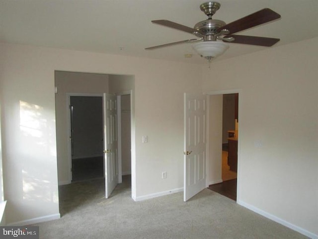 6212 Westchester Park Dr Unit J, College Park, MD 20740 - unfurnished bedroom featuring carpet, baseboards, and a ceiling fan