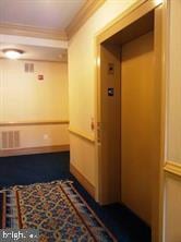 6212 Westchester Park Dr Unit J, College Park, MD 20740 - mudroom with ornamental molding