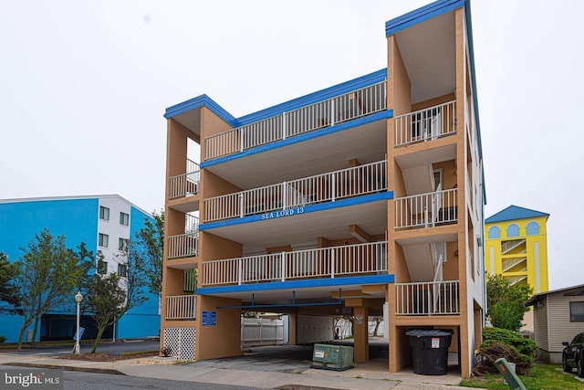 13 60th St Unit 201, Ocean City, MD 21842 - view of apartment building / complex featuring a carport