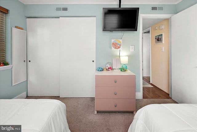 13 60th St Unit 201, Ocean City, MD 21842 - bedroom with a closet, crown molding, and carpet flooring