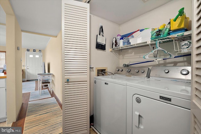 13 60th St Unit 201, Ocean City, MD 21842 - laundry room featuring washer and clothes dryer and wood finished floors
