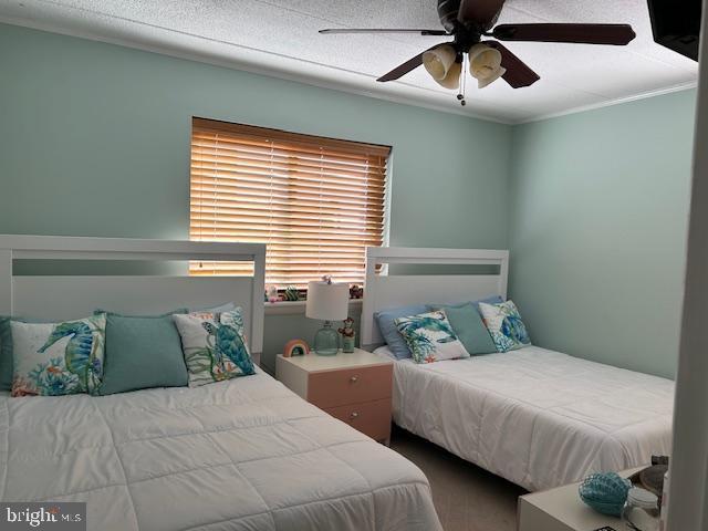13 60th St Unit 201, Ocean City, MD 21842 - bedroom with ceiling fan and ornamental molding
