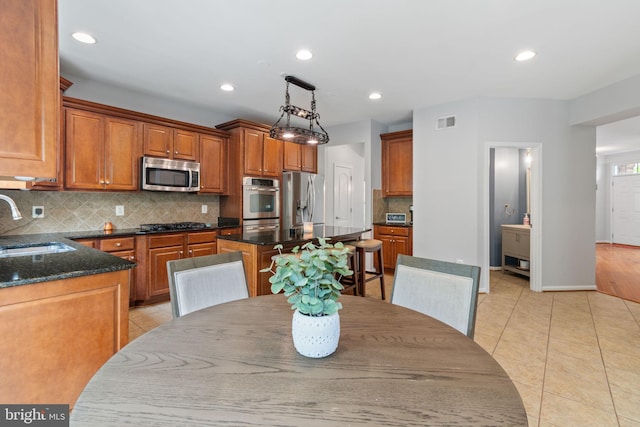 42026 Zircon Dr, Aldie, VA 20105 - dining space featuring light tile patterned flooring, recessed lighting, and baseboards