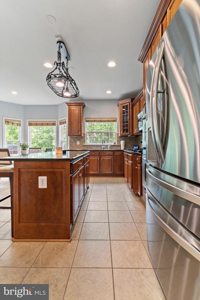 42026 Zircon Dr, Aldie, VA 20105 - kitchen with appliances with stainless steel finishes, plenty of natural light, tasteful backsplash, recessed lighting, and a kitchen island