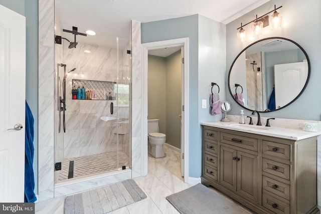42026 Zircon Dr, Aldie, VA 20105 - full bath featuring vanity, a stall shower, marble finish flooring, toilet, and baseboards