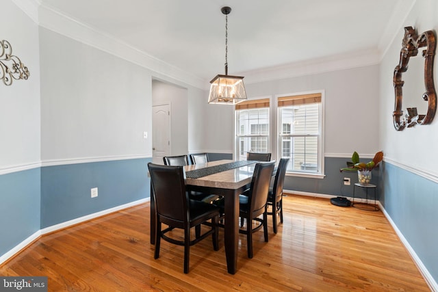 42026 Zircon Dr, Aldie, VA 20105 - dining area featuring wood finished floors, a chandelier, ornamental molding, and baseboards