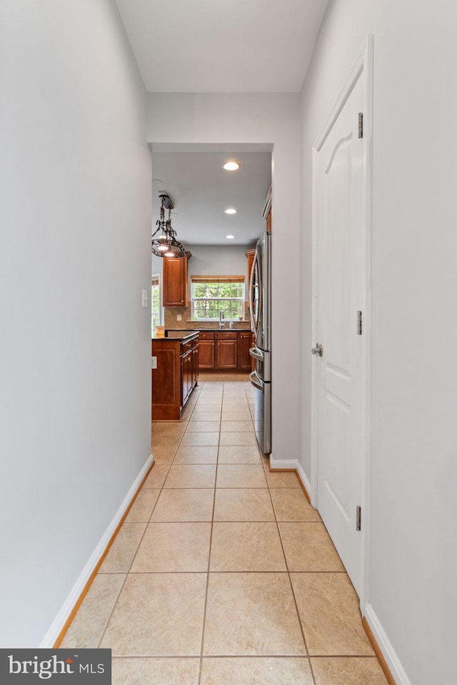 42026 Zircon Dr, Aldie, VA 20105 - corridor with a sink, light tile patterned floors, baseboards, and recessed lighting