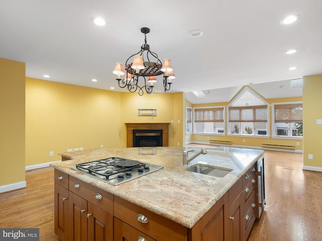 2000 N Bancroft Pkwy, Wilmington, DE 19806 - kitchen with a sink, stainless steel gas stovetop, open floor plan, baseboards, and recessed lighting