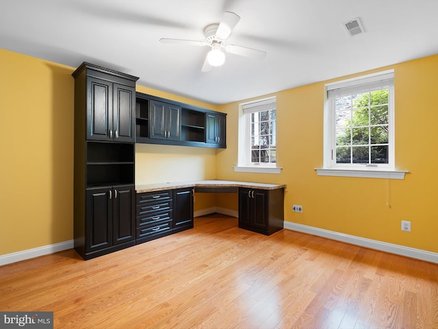 2000 N Bancroft Pkwy, Wilmington, DE 19806 - unfurnished office featuring built in study area, light wood finished floors, baseboards, and ceiling fan