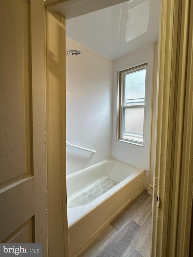 33 New Dorwart St, Lancaster, PA 17603 - full bathroom with wood finished floors, a tub, and a shower