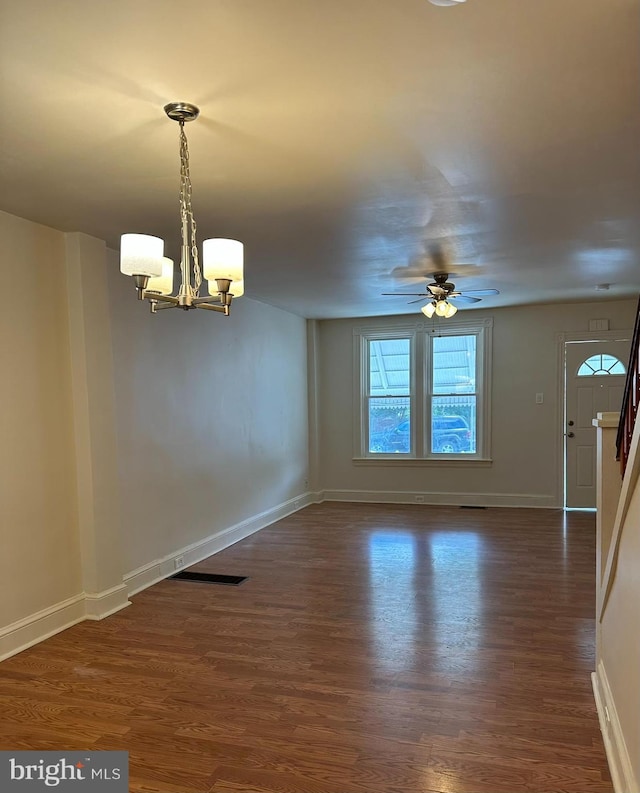33 New Dorwart St, Lancaster, PA 17603 - unfurnished room featuring a chandelier, dark wood finished floors, ceiling fan, and baseboards