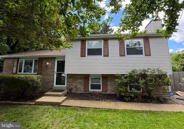 1100 Clarke St, Herndon, VA 20170 - split level home with brick siding and a chimney
