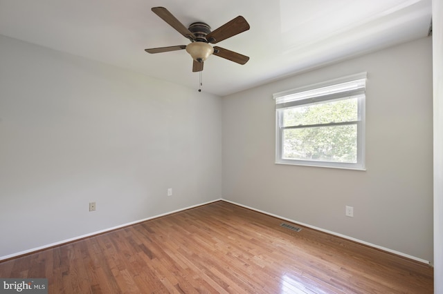 1100 Clarke St, Herndon, VA 20170 - empty room with wood finished floors, baseboards, and ceiling fan