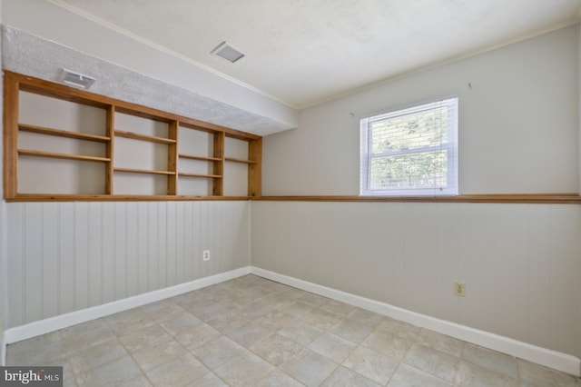 1100 Clarke St, Herndon, VA 20170 - empty room featuring crown molding, baseboards, and wooden walls