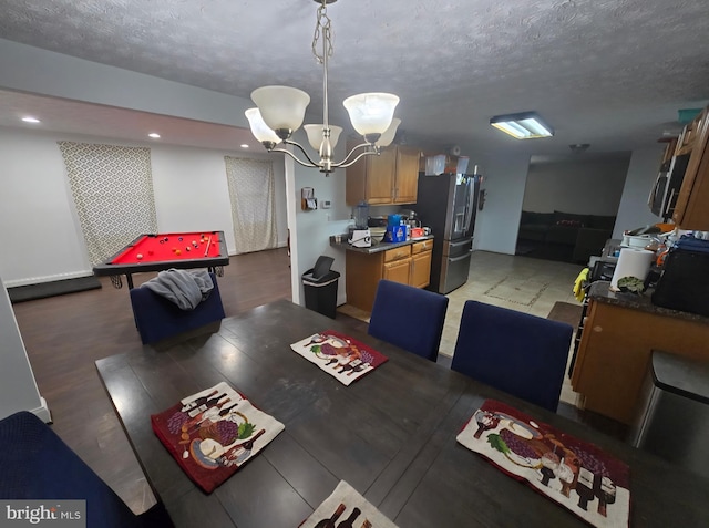 13721 Hobart Dr, Silver Spring, MD 20904 - dining space featuring a chandelier, a textured ceiling, recessed lighting, and light wood-style floors