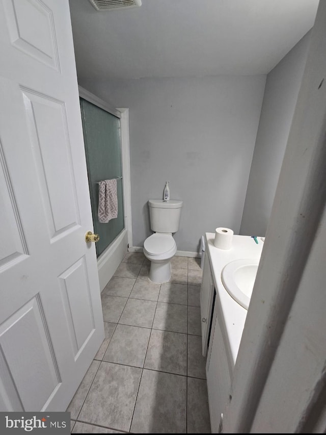 13721 Hobart Dr, Silver Spring, MD 20904 - full bath with vanity, tile patterned flooring, toilet, baseboards, and shower / washtub combination