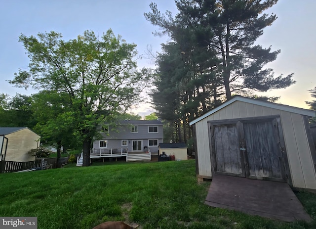 13721 Hobart Dr, Silver Spring, MD 20904 - yard at dusk featuring a lawn and a deck