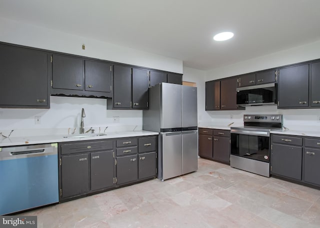 3900 Mark Ave, Harrisburg, PA 17110 - kitchen featuring stainless steel appliances, a sink, and light countertops