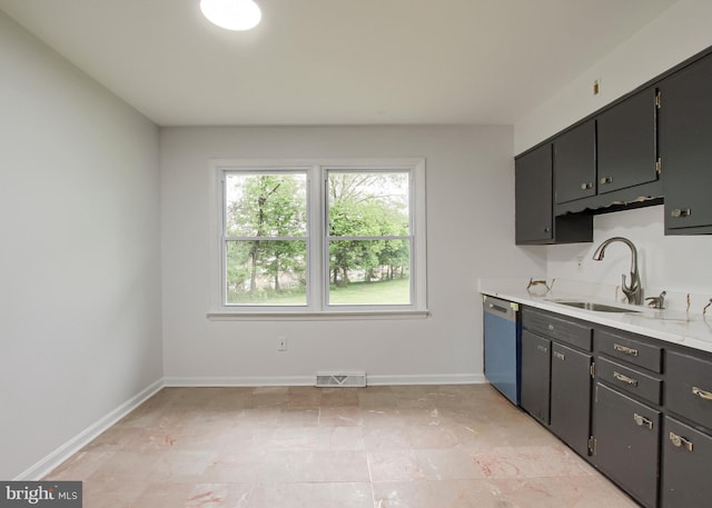 3900 Mark Ave, Harrisburg, PA 17110 - kitchen with dishwasher, a sink, light countertops, and baseboards