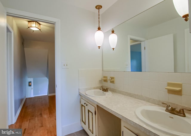 3900 Mark Ave, Harrisburg, PA 17110 - full bathroom featuring tasteful backsplash, double vanity, wood finished floors, and baseboards
