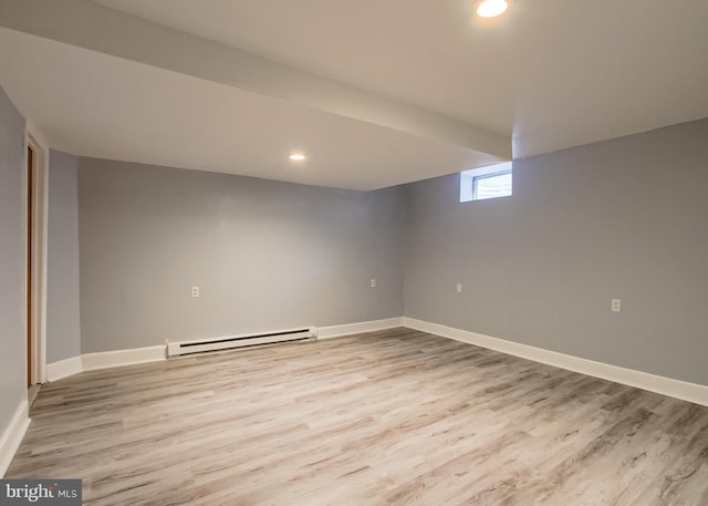 3900 Mark Ave, Harrisburg, PA 17110 - basement featuring a baseboard heating unit, light wood-style flooring, baseboards, and recessed lighting