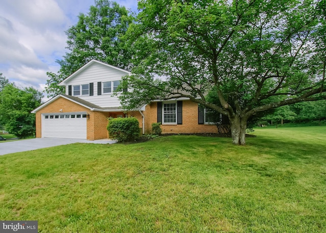 3900 Mark Ave, Harrisburg, PA 17110 - view of front facade with brick siding, concrete driveway, a front lawn, and a garage