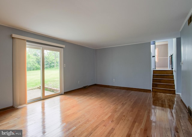 3900 Mark Ave, Harrisburg, PA 17110 - unfurnished room featuring light wood finished floors, stairway, and baseboards